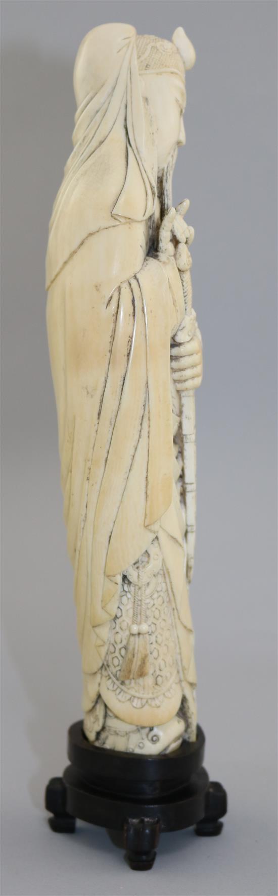 A Chinese ivory tusk figure of Lu Dongbin, late 19th / early 20th century, total height 30.5cm